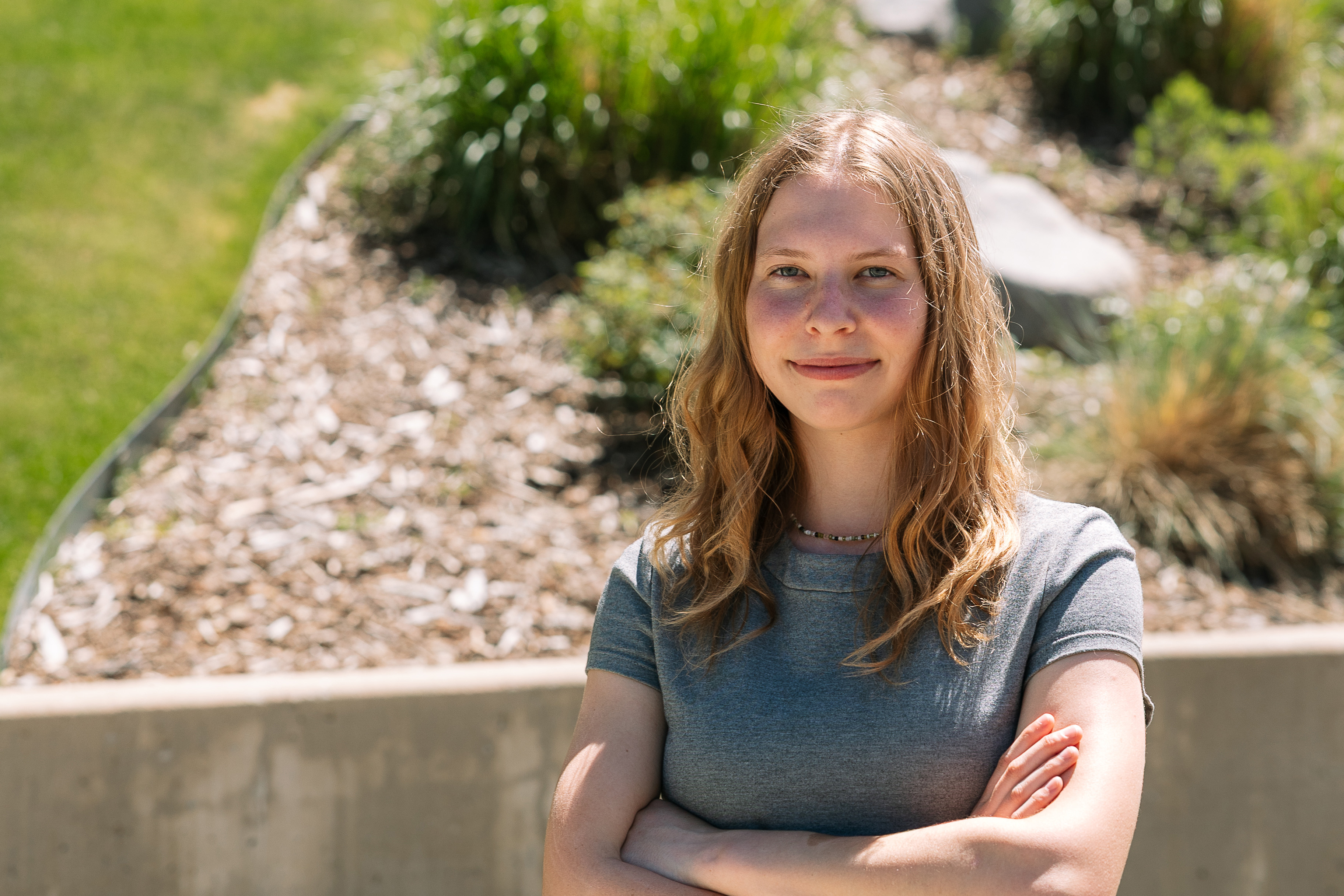 A photo of Eva Lighthiser standing outside for a portrait.