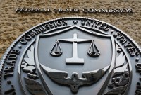 A photo of the Federal Trade Commission's logo on the outside of a building.